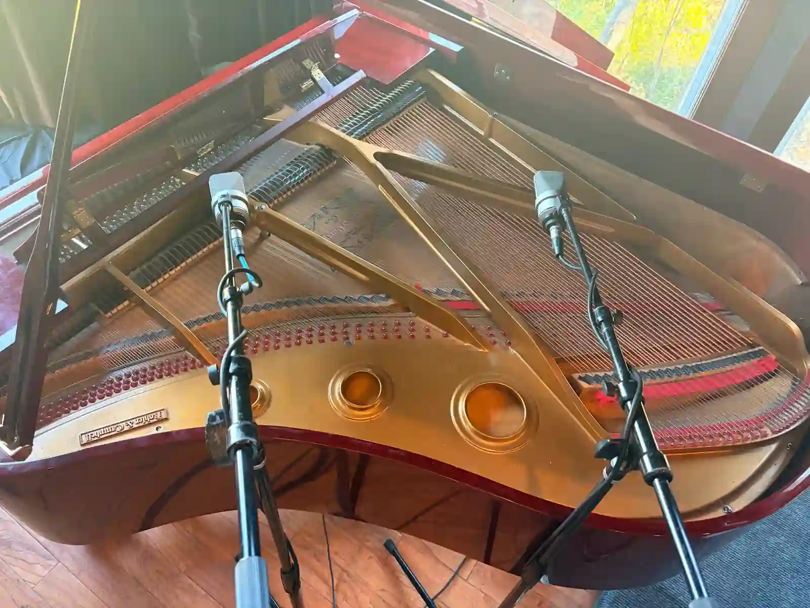 Grand piano miked for recording